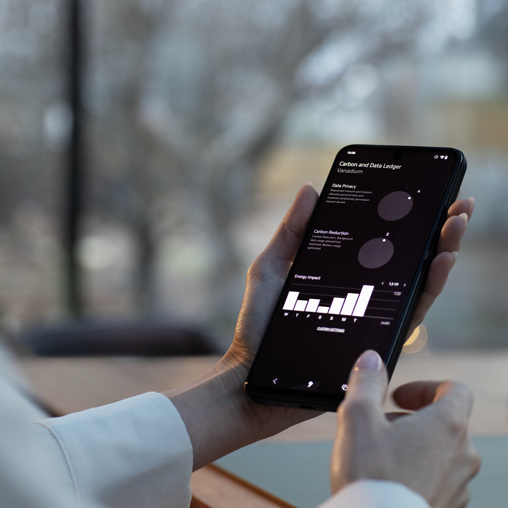hand holding the MC02 smartphone for individual with the screen on the apostrophy data and carbon ledger area