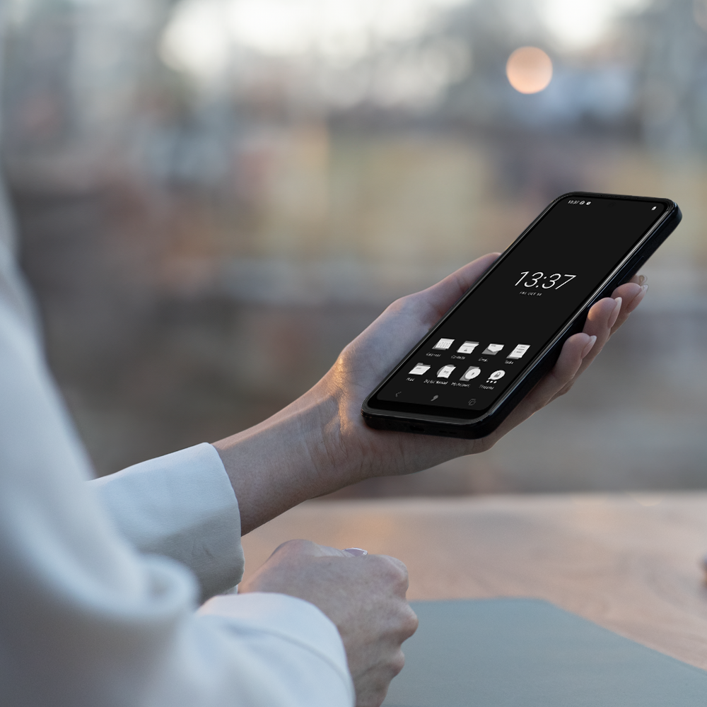 hand holding the mc02 smartphone with domus